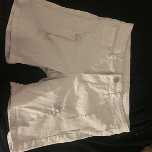 White ripped vip jean shorts